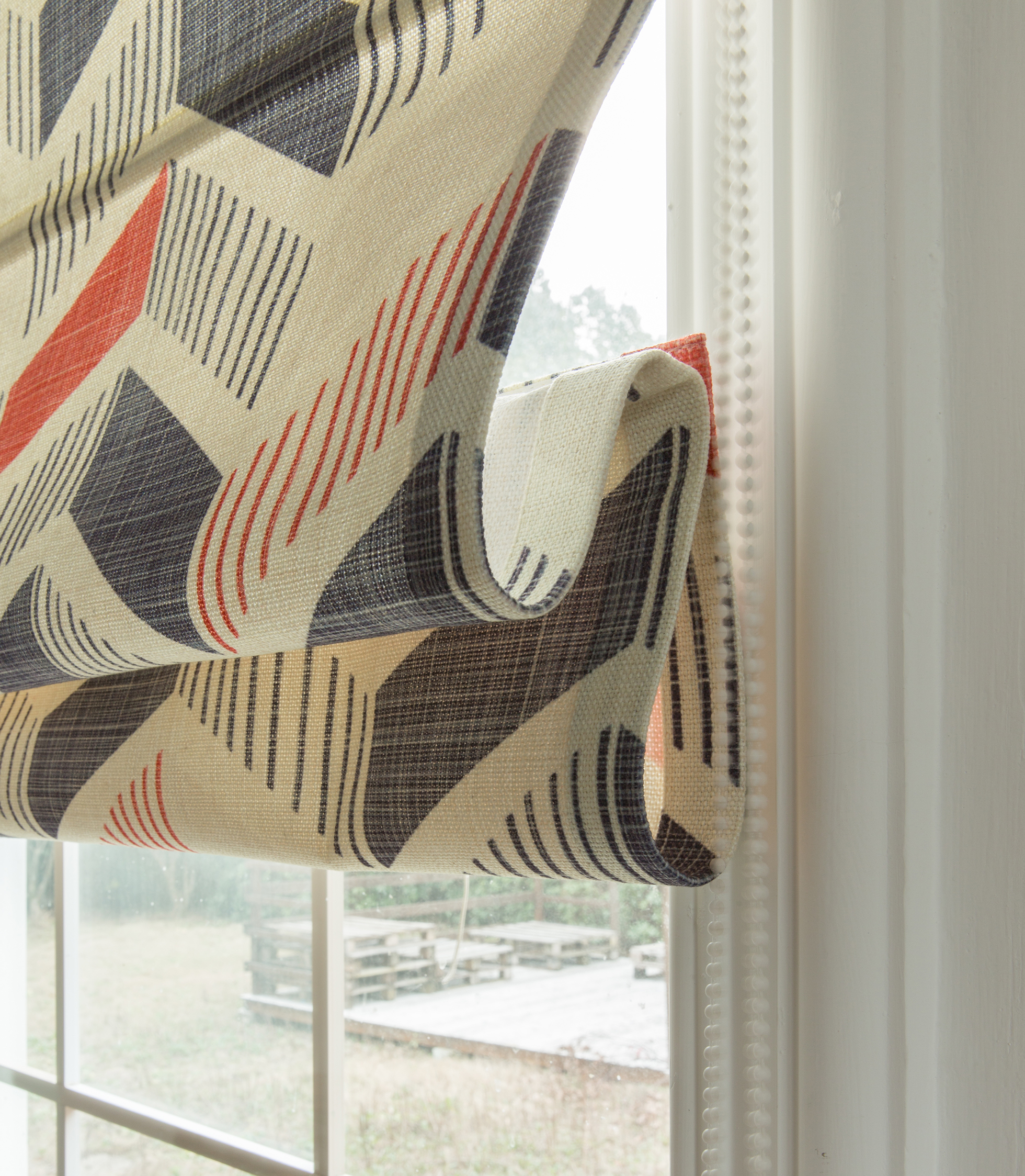 White, red, and blue washable Roman window shade