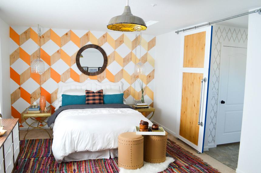 Remodeled bathroom with orange patterned walls