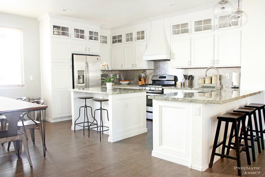 Bright white cabinets and a dark wood floor