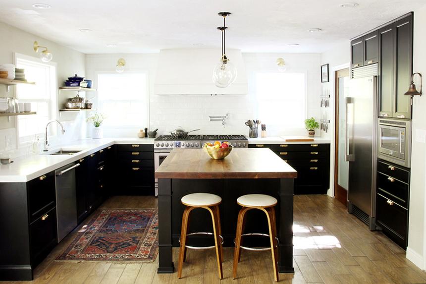 Updated kitchen with black cabinets, white countertops