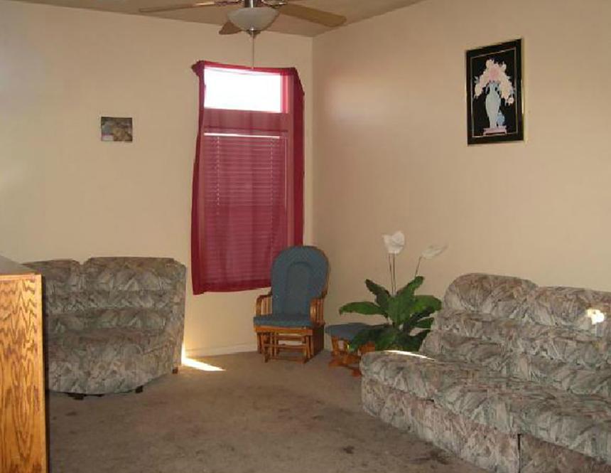 Living room with dirty beige carpet