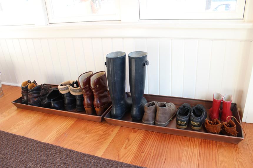Winter boot drying rack in a home entryway